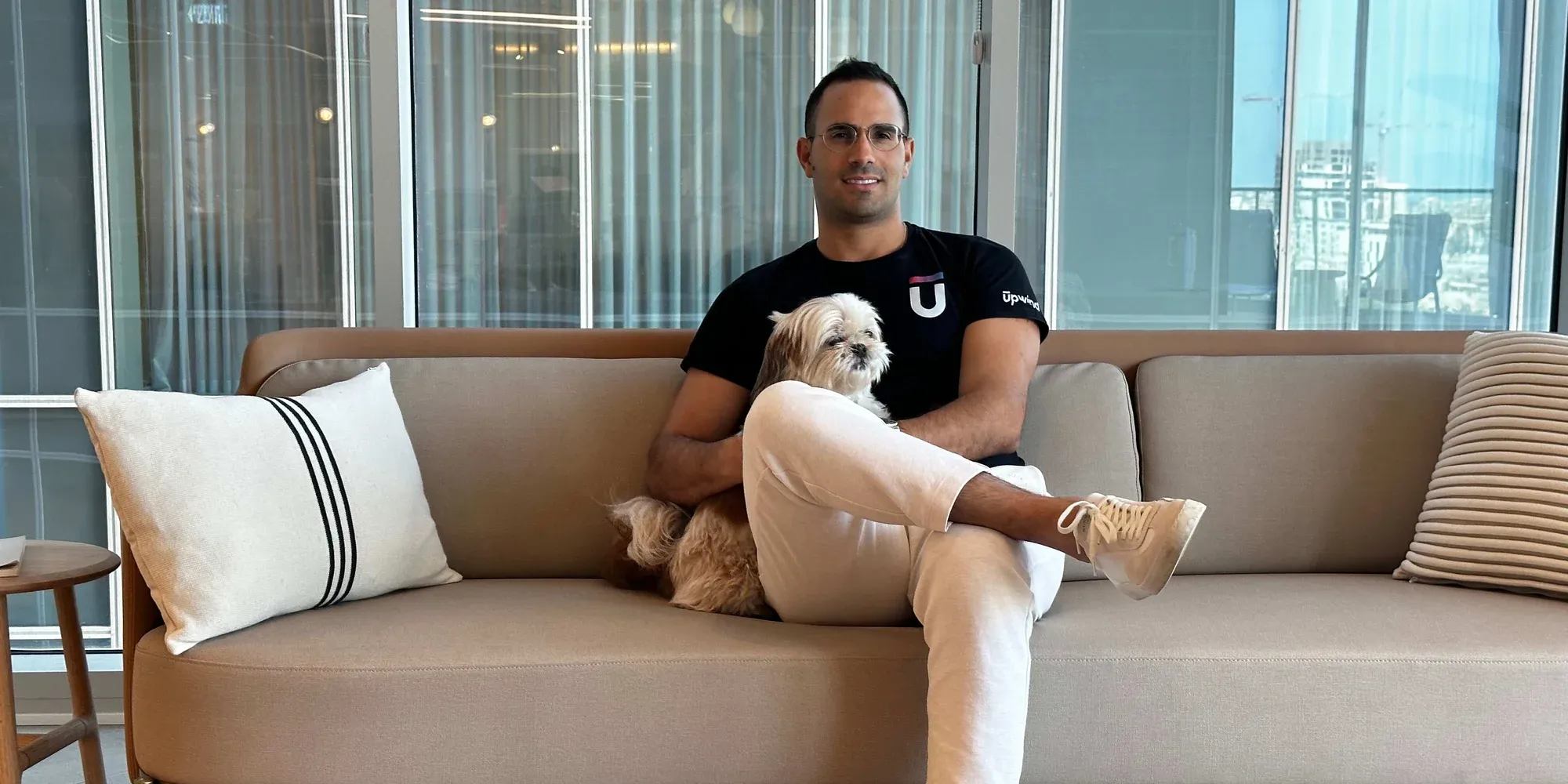 Upwind chief executive Amiram Shachar on a sofa with his dog