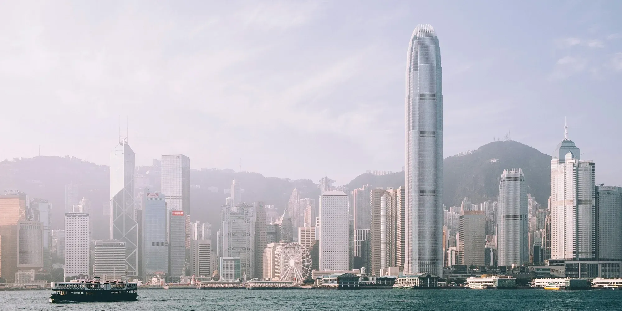 Hong Kong skyline across Victoria Harbour with a Star Ferry