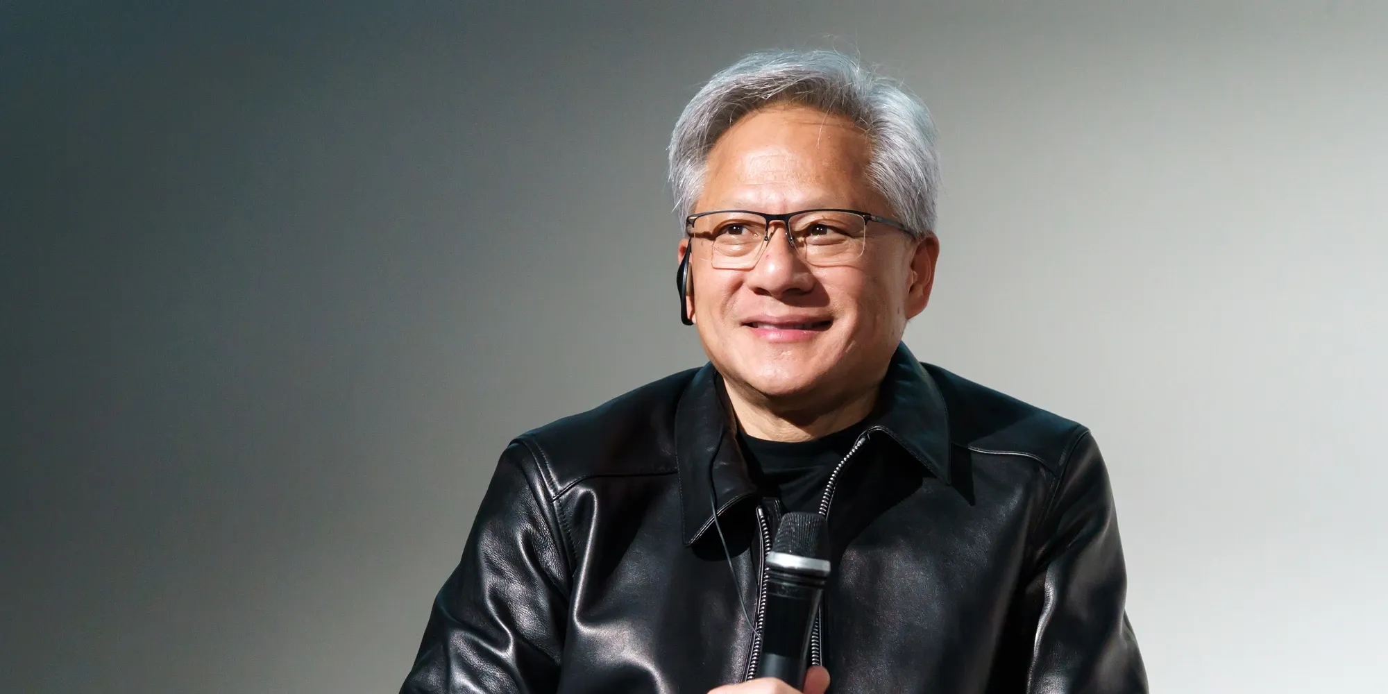 Nvidia CEO Jensen Huang speaking with a microphone