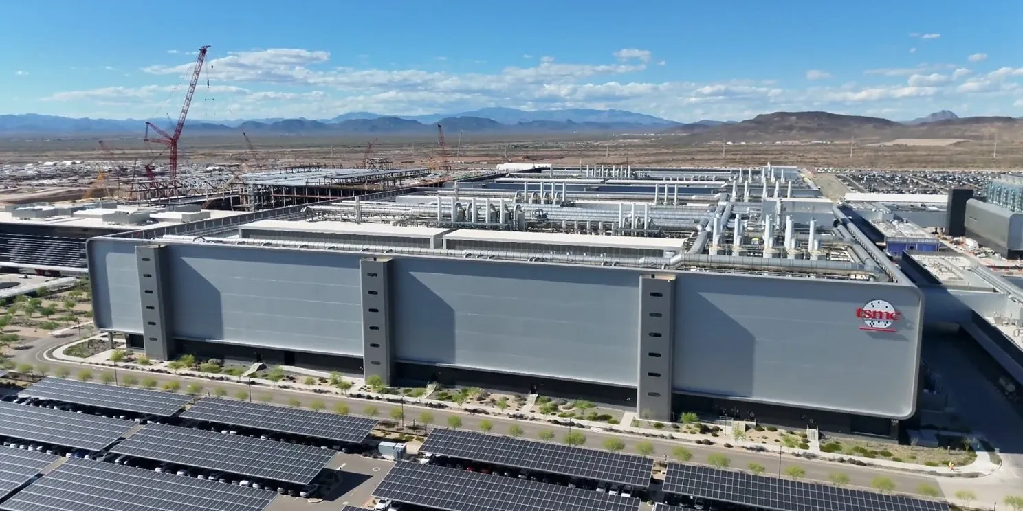 TSMC's fab site in Arizona, with construction cranes behind the finished fab