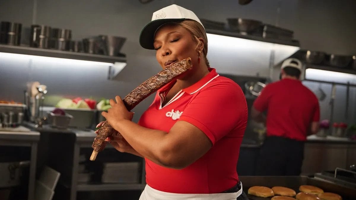 Lizzo playing a rib-shaped flute in Chili's Baby Back Ribs campaign