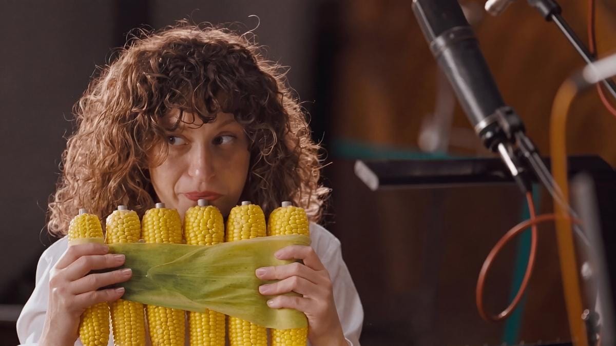 A London Vegetable Orchestra musician plays a corn instrument for Chipotle